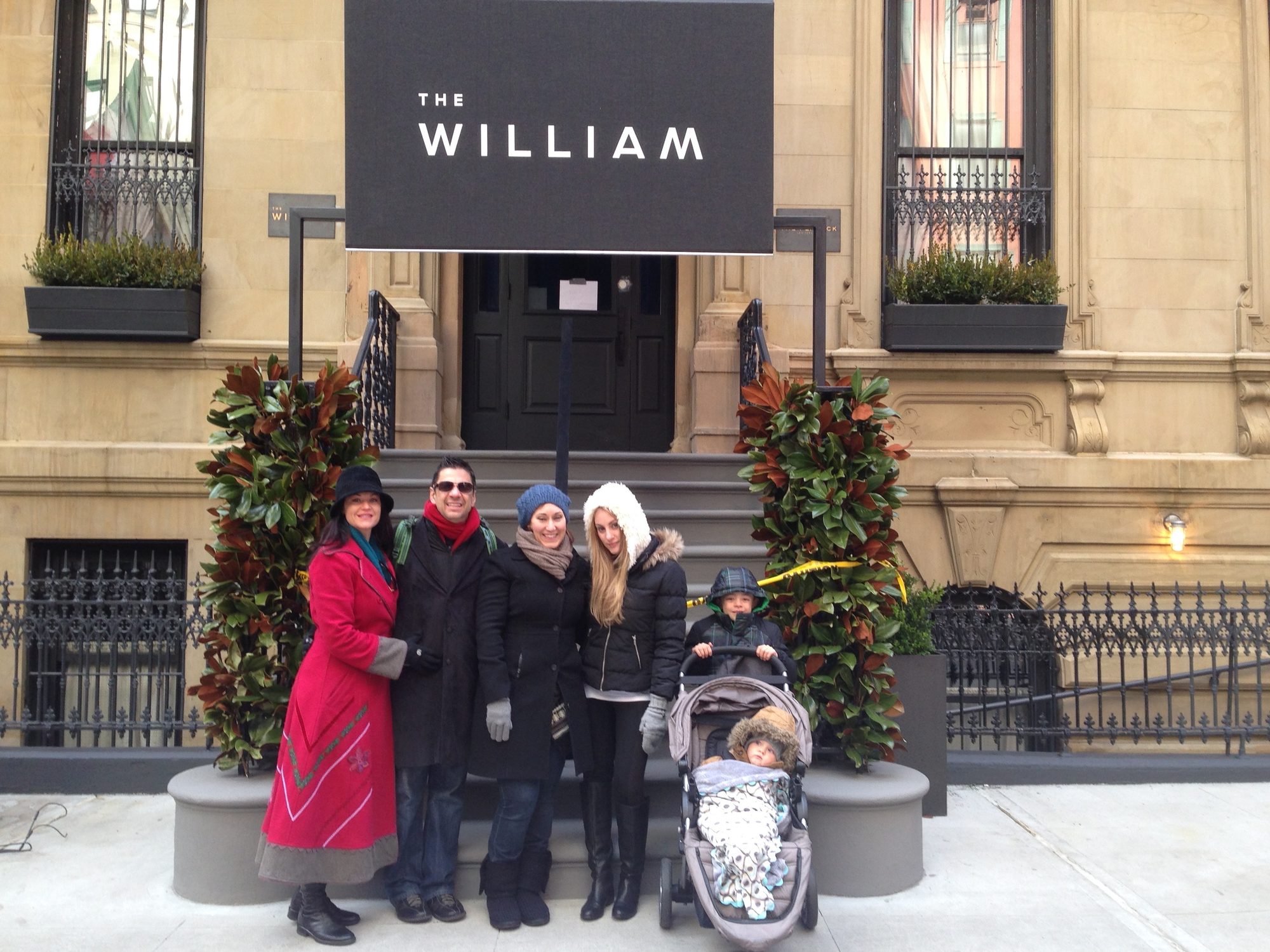 Michael Fuller and family under The William awning at 24 East 39th Street, New York, December 2013.
